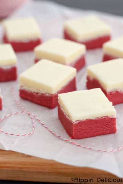 Easy red velvet fudge with a cream cheese frosting fudge layer is a decadent treat! Naturally gluten-free.