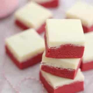 Easy red velvet fudge with a cream cheese frosting fudge layer is a decadent treat! Naturally gluten-free.