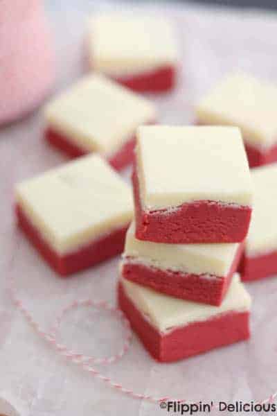 Easy red velvet fudge with a cream cheese frosting fudge layer is a decadent treat! Naturally gluten-free. 