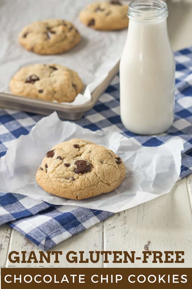 gluten free chocolate chip cookies on a wooden table with a blue checked napkin and a milk bottle full of milk