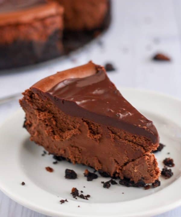 Gluten-free death by chocolate cheesecake is the ULTIMATE chocolate cheesecake and the perfect decadent dessert. Crunchy chocolate cookie crust with rich, creamy, chocolate cheesecake filling and topped with a sweet, smooth chocolate ganache.