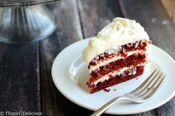 Step-by-step photos make stacking three layers of gluten free red velvet cake piped w/ fluffy rosettes a 