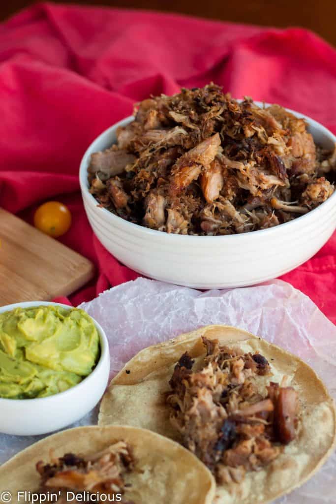 Nothing is easier than throwing these easy crispy carnitas in the slow cooker at lunch, and then enjoying them for dinner with some gluten free corn tortillas.