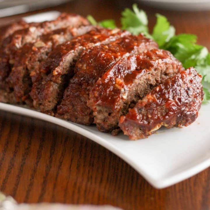 Gluten free slow cooker meatloaf is moist and tender, with a delicious crusty glaze. This is comfort food at its very finest!