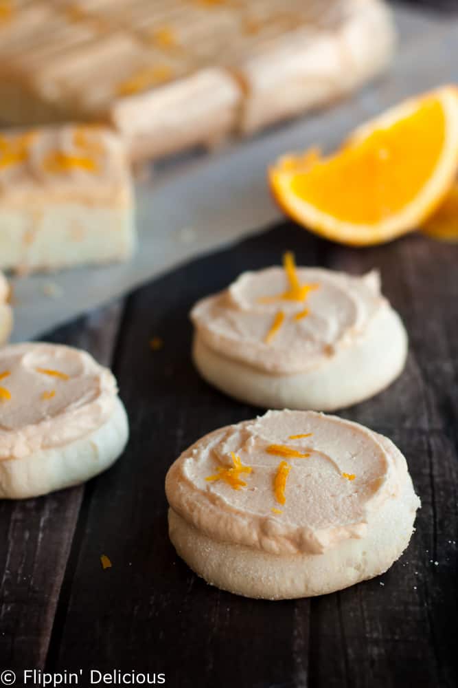 gluten free soft orange frosted sugar cookies with orange zest