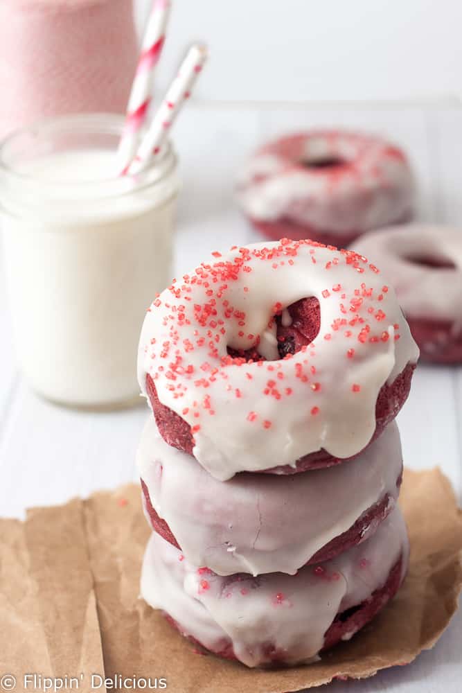 This Dairy Free Gluten Free Baked Red Velvet Donut Recipe is quick and easy to make, allergy friendly, and has all the classic red velvet flavors (including a dairy free cream cheese flavored glaze.)