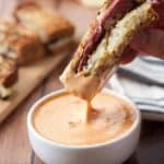 These Gluten Free Reuben Sandwich Dippers are my twist on the classic Reuben sandwich. Made with gluten free rye-style bread, pastrami, swiss cheese, sauerkraut, mustard and served with Thousand Island to dip. The perfect appetizer to share or hearty lunch!