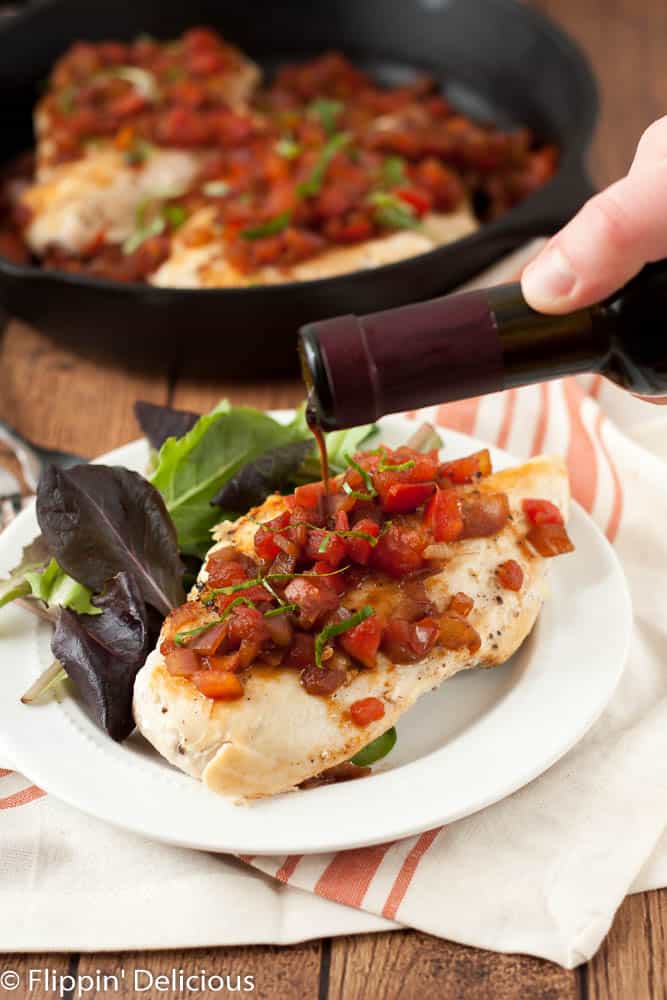 This Bruschetta Chicken Skillet combines all of the flavors of fresh roma tomatoes, sweet red onions, and syrupy balsamic vinegar in an easy naturally gluten free and dairy free weeknight meal.