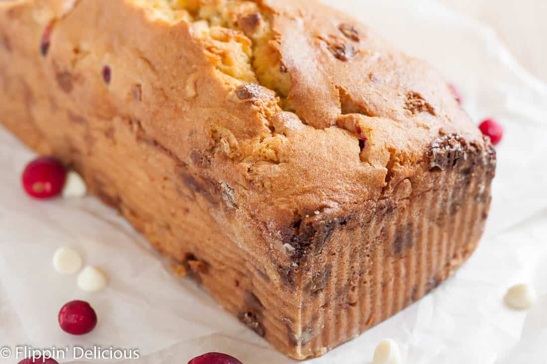 Moist gluten free cranberry bread with orange, white chocolate, and hazelnuts is the ultimate holiday quick bread! Dairy free option.