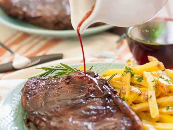 Red Wine Marinated Steak with Baked Garlic and Herb Fries