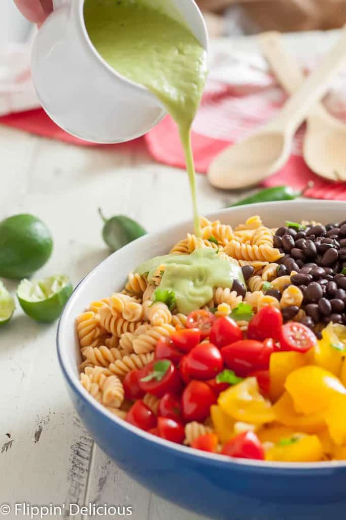 Gluten free southwest pasta salad has a kick you won’t get from a regular pasta salad! It’s perfect for summer potlucks.