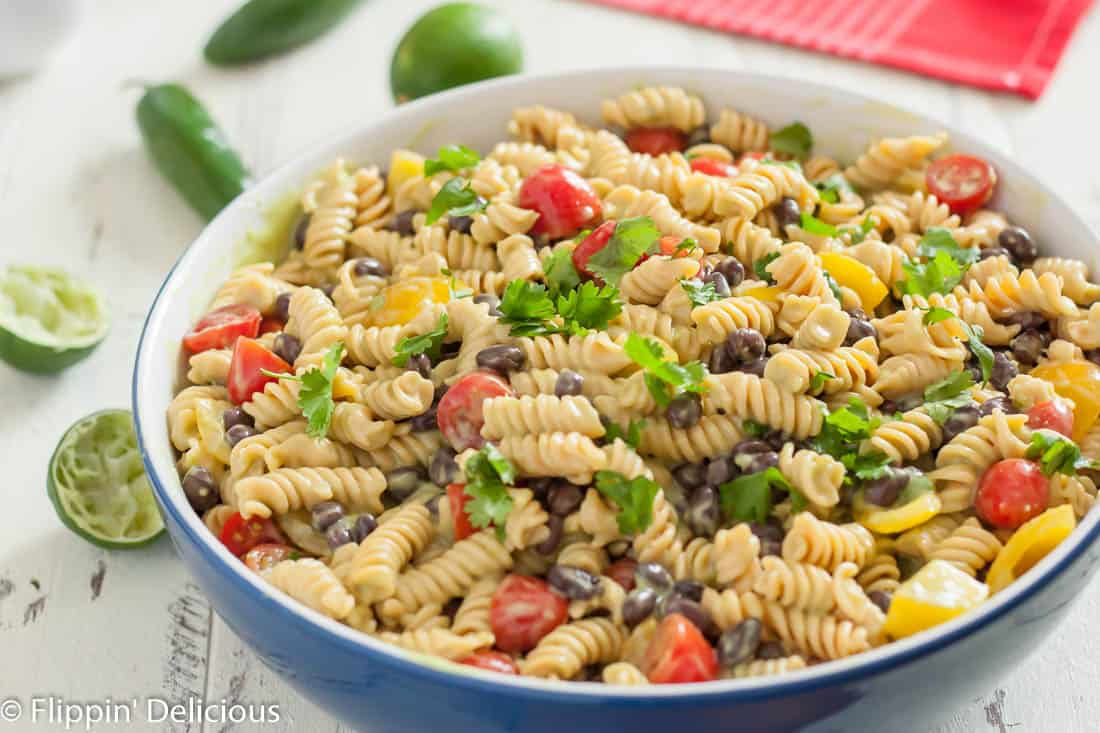 Gluten free southwest pasta salad has a kick you won’t get from a regular pasta salad! It’s perfect for summer potlucks.