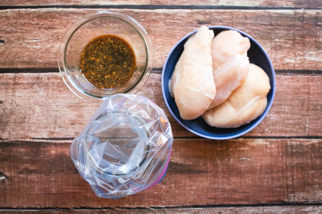 gluten free teriyaki marinade and chicken on a wooden table