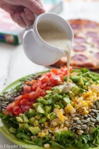 This New Mexican Chopped Salad with Hatch Green Chile Vinaigrette makes the perfect weeknight meal when combined with gluten free green chile pepperoni pizza!