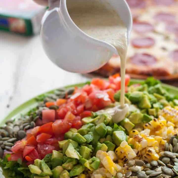 This New Mexican Chopped Salad with Hatch Green Chile Vinaigrette makes the perfect weeknight meal when combined with gluten free green chile pepperoni pizza!