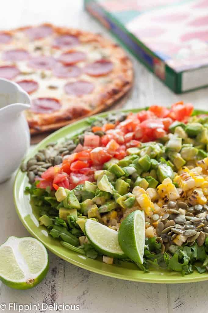 This New Mexican Chopped Salad with Hatch Green Chile Vinaigrette makes the perfect weeknight meal when combined with gluten free green chile pepperoni pizza!