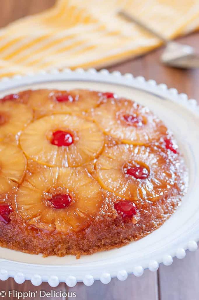 Gluten Free Pineapple Upside Down Cake is a classic dessert with gooey brown sugar, pineapple rings, and cherries. Dairy free option!