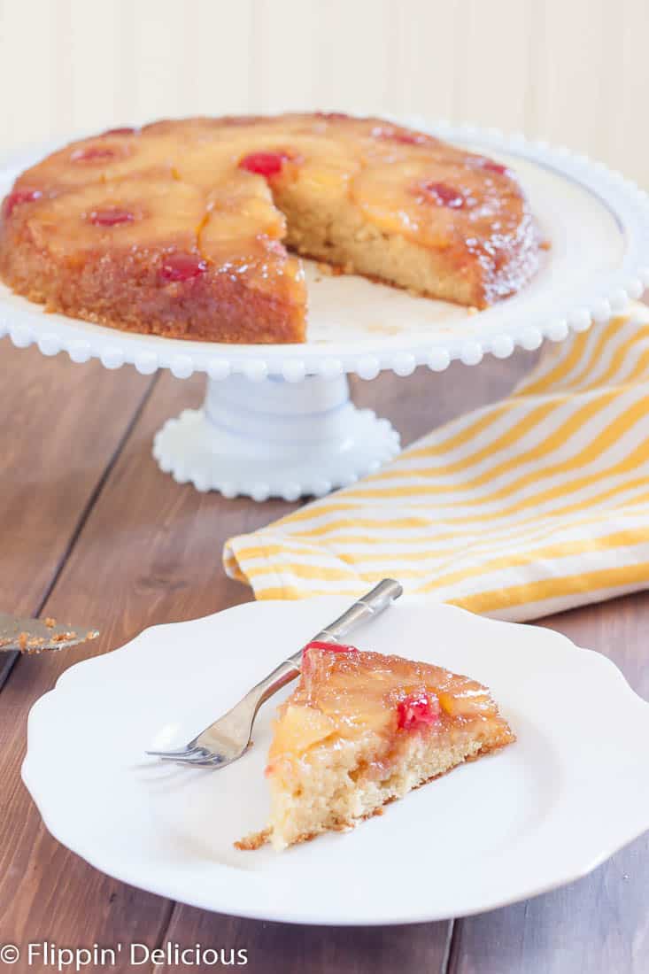 Gluten Free Pineapple Upside Down Cake is a classic dessert with gooey brown sugar, pineapple rings, and cherries. Dairy free option!