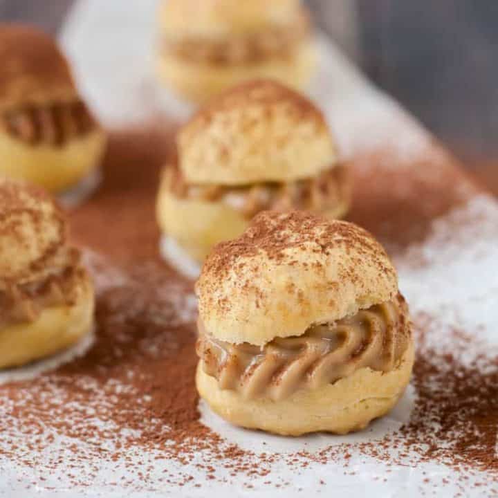 Gluten free tiramisu cream puffs have all the flavors and textures of the classic Italian dessert in a fun bite-sized dessert. The perfect pick-me-up!