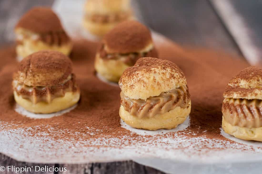 Gluten free tiramisu cream puffs have all the flavors and textures of the classic Italian dessert in a fun bite-sized dessert. The perfect pick-me-up!