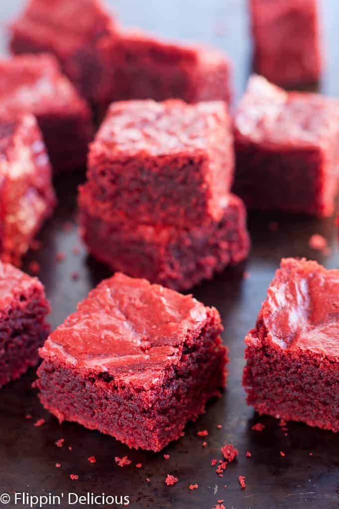 Gluten Free Red Velvet Brownies (dairy free, too) are chewy and fudgy with just a hint of cocoa and vanilla.