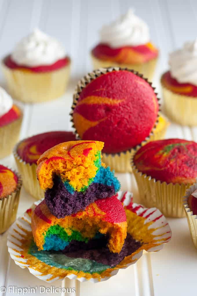 Gluten-Free Rainbow Cupcakes with vanilla frosting will make everyone swoon! Brightly-colored vanilla cupcakes with the perfect tender crumb, topped with a fluffy vanilla bean frosting. Whether you bake them up for the little leprechauns in your life or serve at a birthday party for the young-at-heart, they are sure to be a hit.