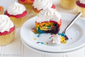 Gluten-Free Rainbow Cupcakes with vanilla frosting will make everyone swoon! Brightly-colored vanilla cupcakes with the perfect tender crumb, topped with a fluffy vanilla bean frosting. Whether you bake them up for the little leprechauns in your life or serve at a birthday party for the young-at-heart, they are sure to be a hit.
