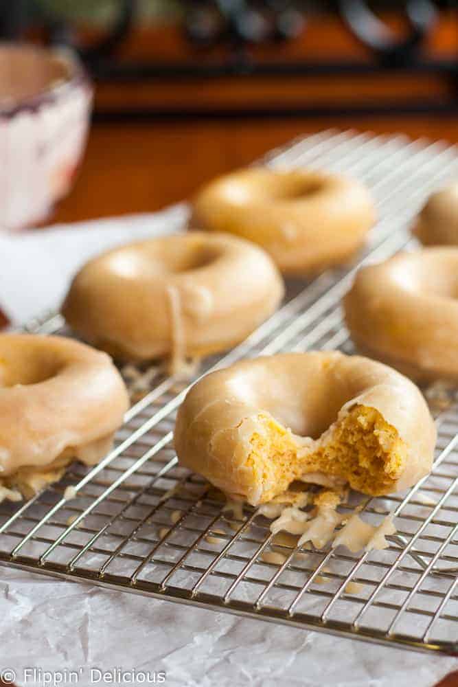 Tender gluten-free pumpkin donuts with maple glaze make the perfect allergy-friendly fall treat!