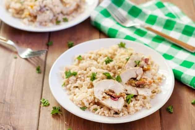 stuffed turkey tenderloin on a plate with rice