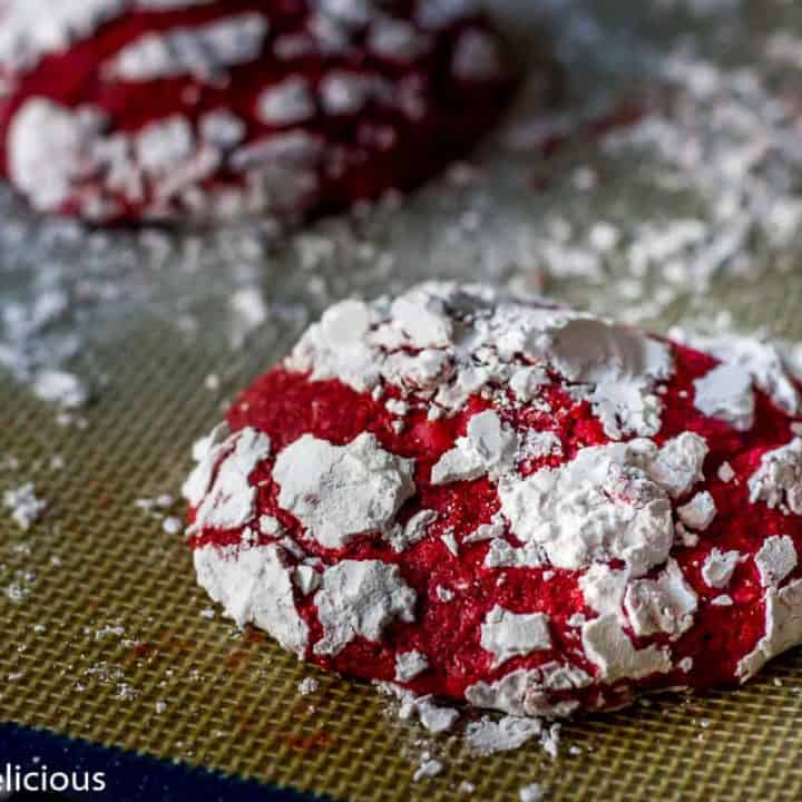 Gluten Free Red Velvet Crinkle Cookies are soft and cakey, with hints of real cocoa and vanilla. Covered in sweet powdered sugar, they make a fun and festive cookie.