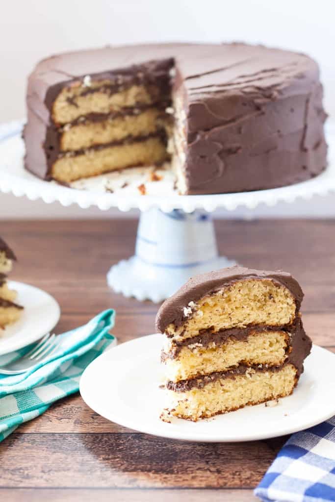 Gluten Free Yellow Cake with Chocolate Fudge Frosting has a moist and tender crumb with creamy chocolate fudge frosting. Vegan and Dairy Free options.