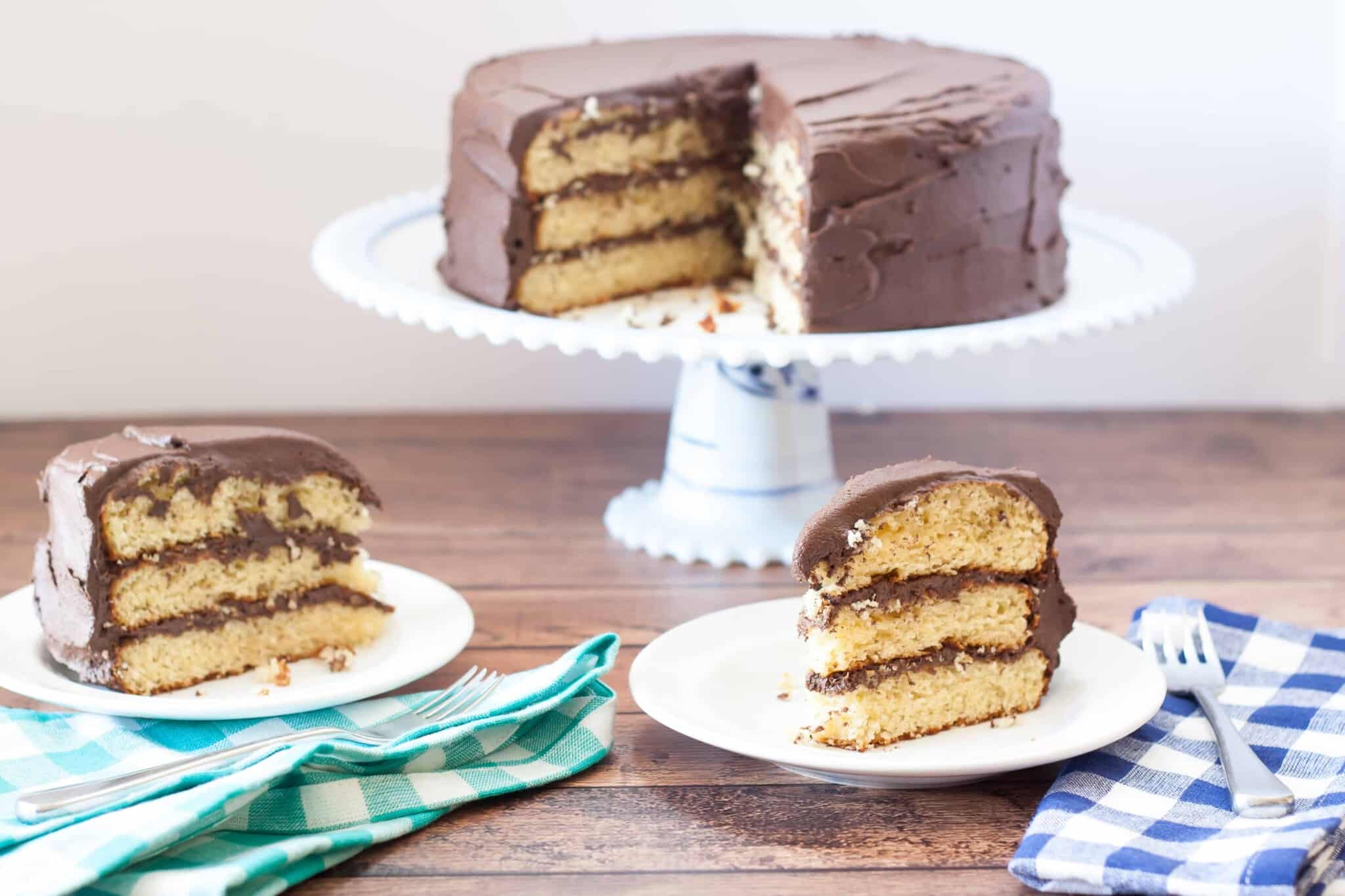 Gluten Free Yellow Cake with Chocolate Fudge Frosting has a moist and tender crumb with creamy chocolate fudge frosting. Vegan and Dairy Free options.