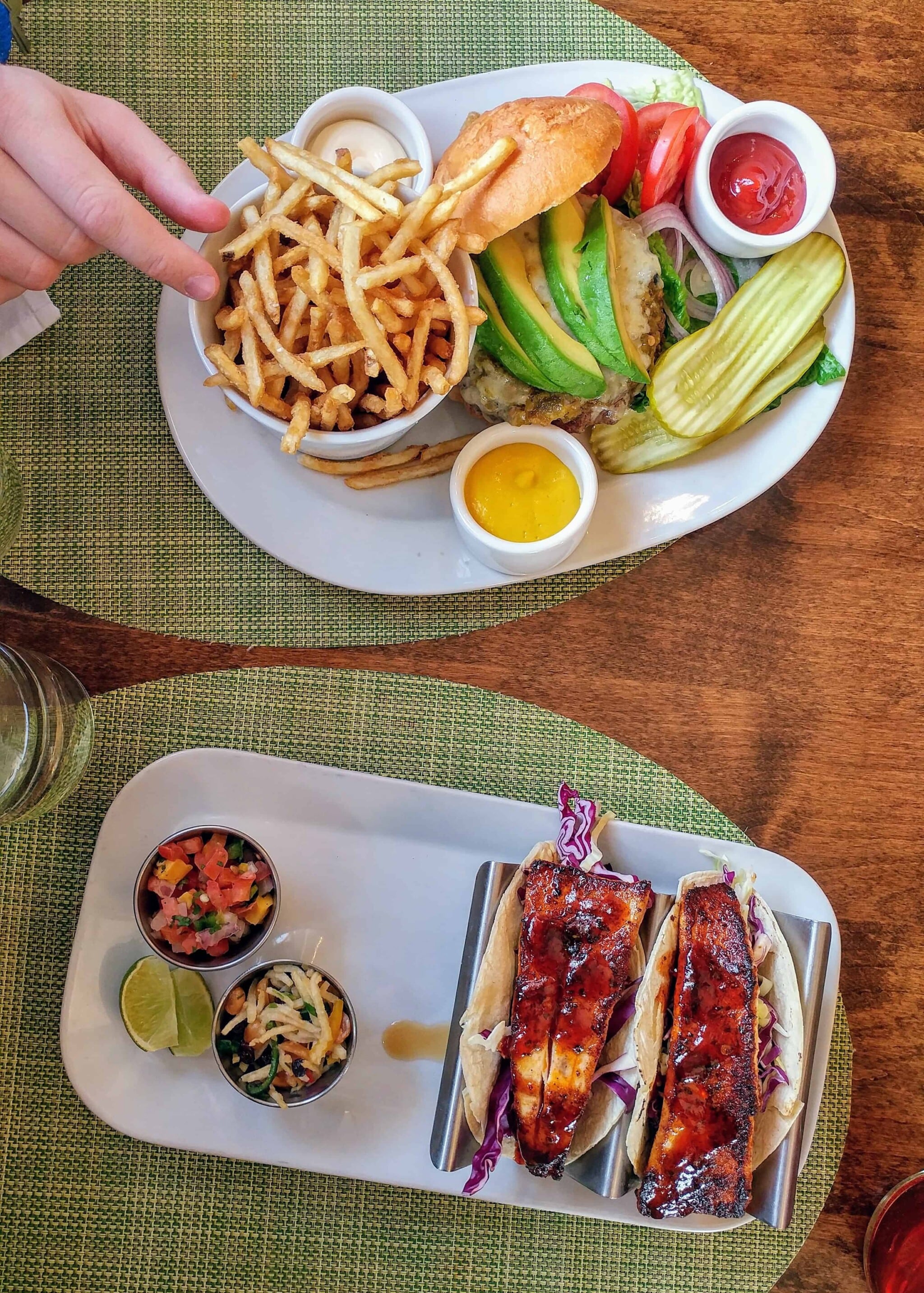 fish taco and burger with avocado on top and fries at ojo caliente new mexico