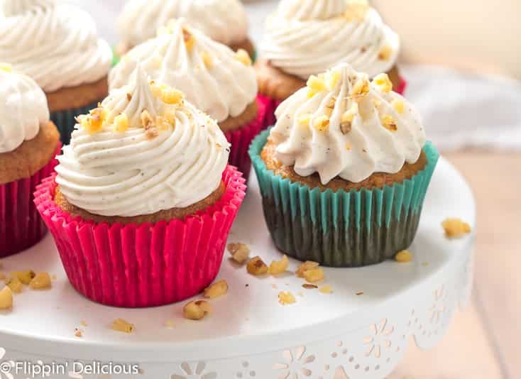 Gluten Free Carrot Cake Cupcakes- Tender, lightly sweet, studded with walnuts, and (dare I say) moist, these cupcakes are perfect for the carrot cake lover in your life. Topped with a fluffy whipped cream cheese frosting, each bite is perfection.