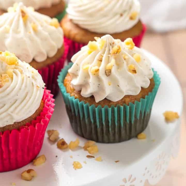 Gluten Free Carrot Cake Cupcakes- Tender, lightly sweet, studded with walnuts, and (dare I say) moist, these cupcakes are perfect for the carrot cake lover in your life. Topped with a fluffy whipped cream cheese frosting, each bite is perfection.