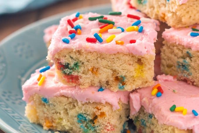 Gluten Free Funfetti Sugar Cookie Bars- Soft frosted gluten free confetti sugar cookie bars with sprinkles inside, and out. These cookies are for the sprinkle-loving party-ers out there, myself included.