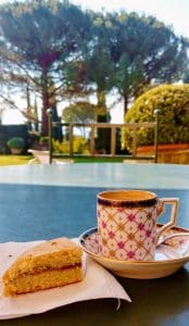 drinking espresso and a gluten free scone at villa boccella, overlooking gardens