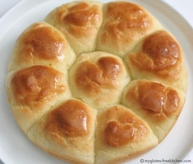 gluten free pull apart dinner rolls on a white plate