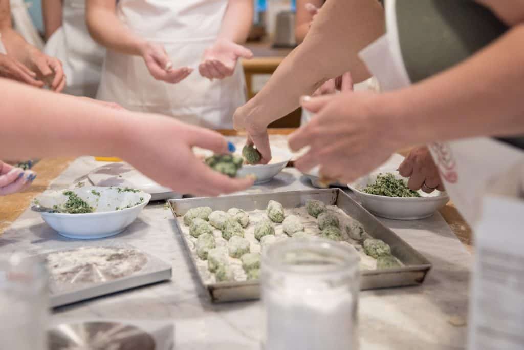 hands making gluten free gnudi at jovial gluten free getaway in lucca