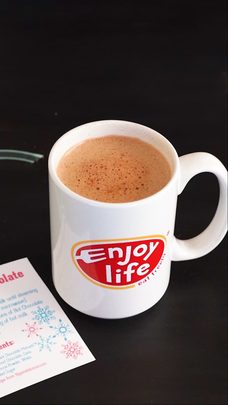 white mug full of creamy vegan hot chocolate