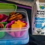 kids lunchbox container packed with nut free dairy free gluten free lunch and a dairy free oat mylk container