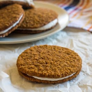 gluten free oatmeal creme pie on a piece of parchment paper