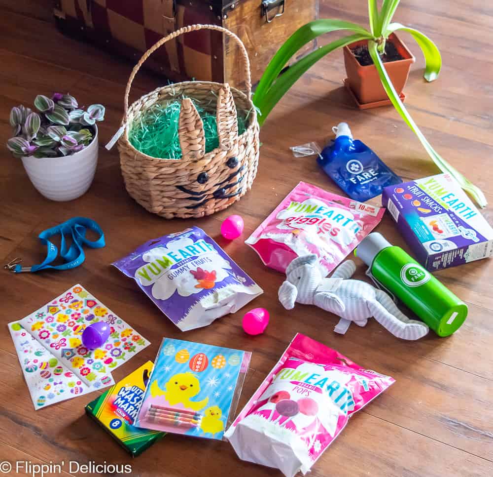what to put in an allergy-friendly easter basket, toys and easter basket stuffers in front of bunny easter basket