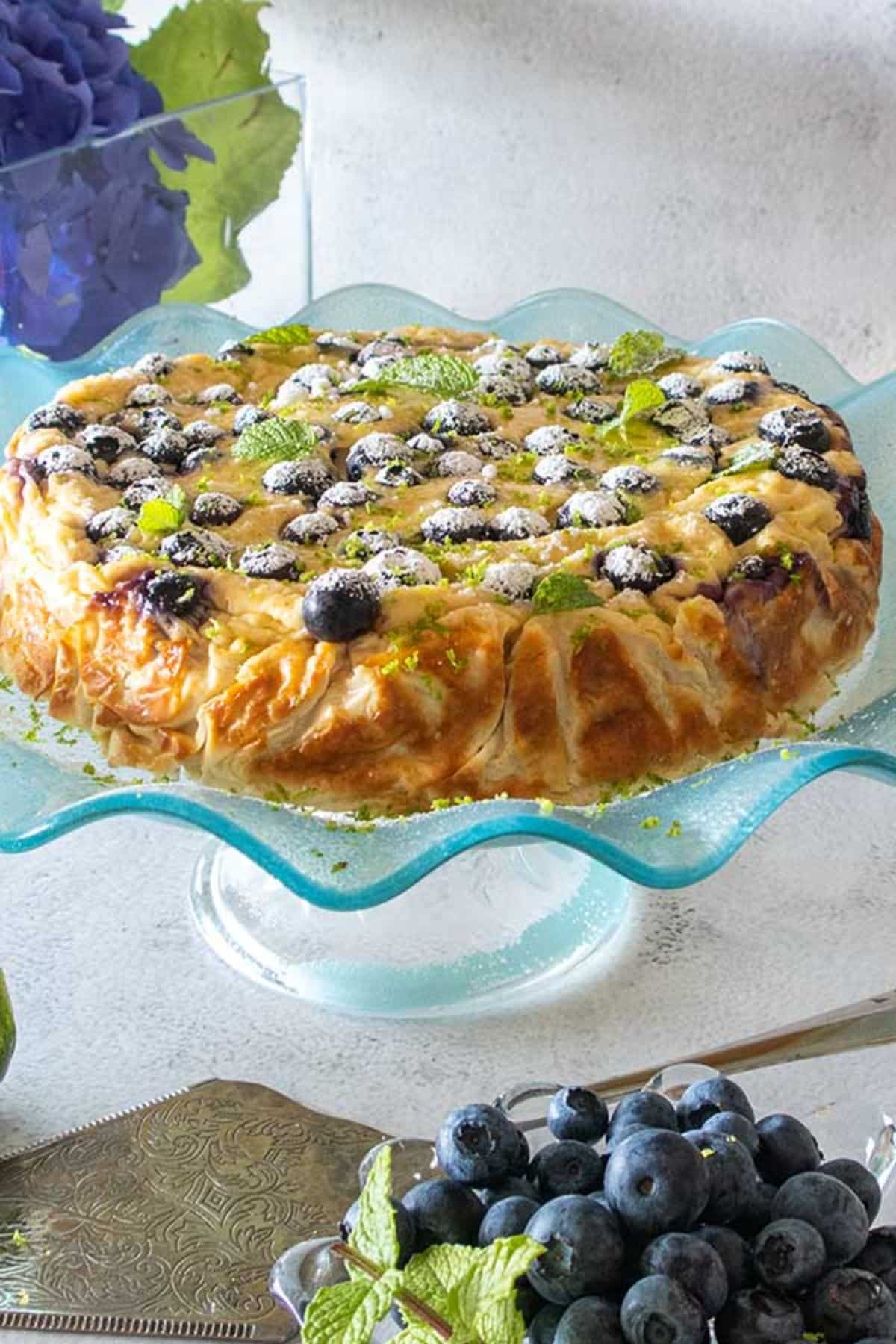 Moroccan-style Yogurt Cake on a glass cake tray.
