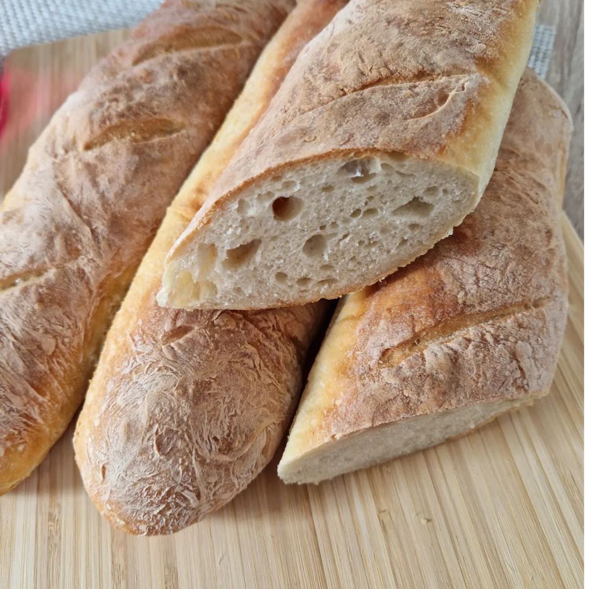 Gluten-Free Baguettes on a wooden cutting board.