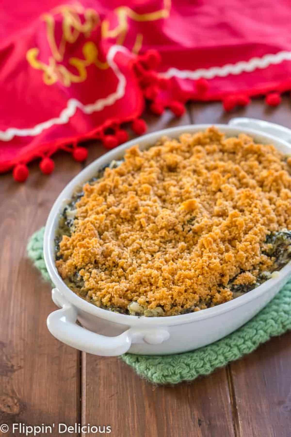 Gluten-Free Spinach Artichoke Dip with Breadcrumbs in a tray.