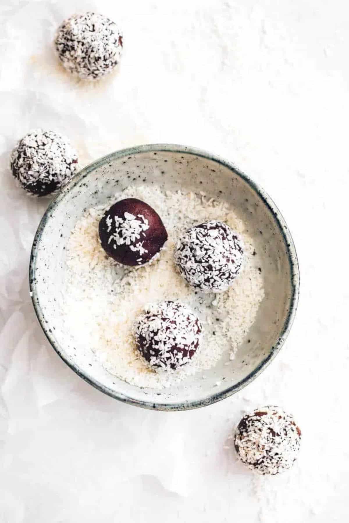 Coconut Almond Bliss Balls in a bowl.