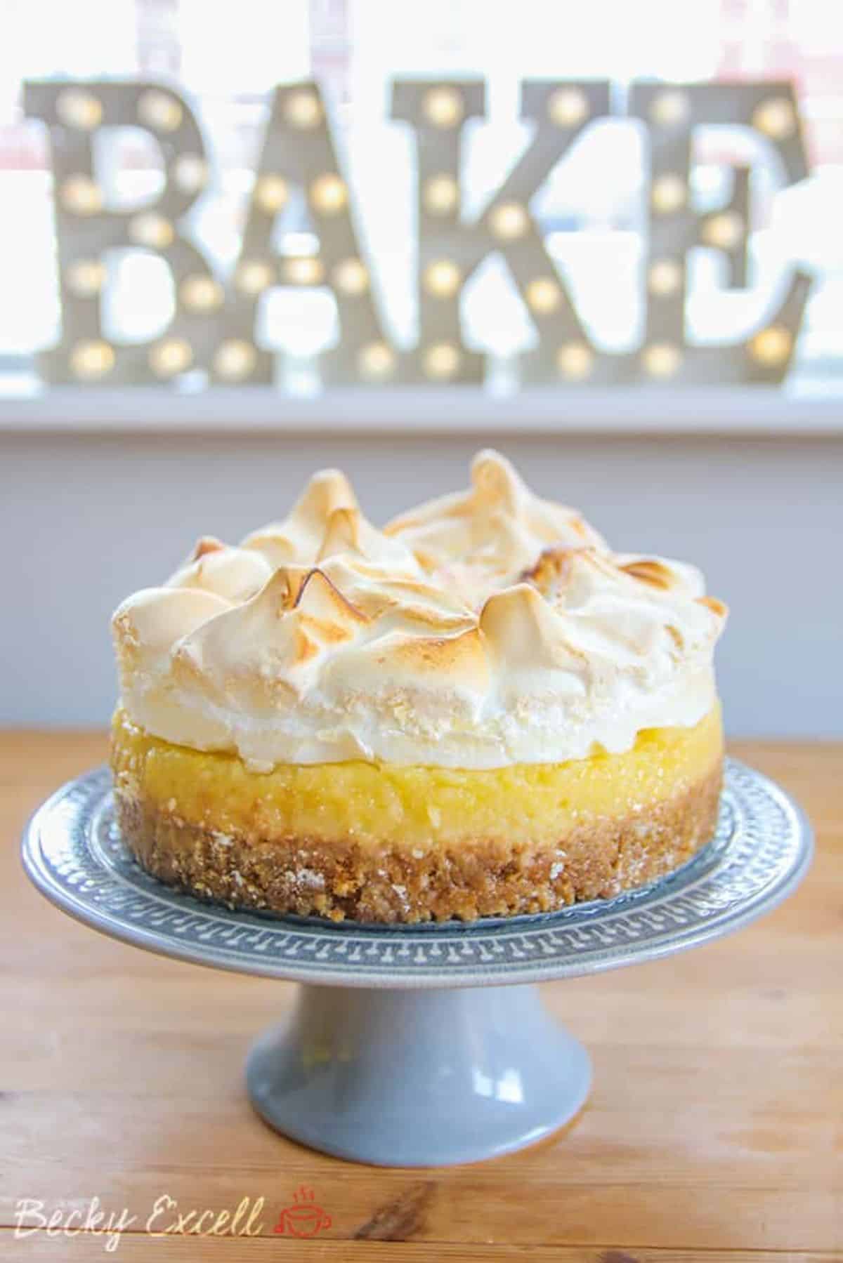 Gluten-Free Lemon Meringue Pie on a blue cake tray.