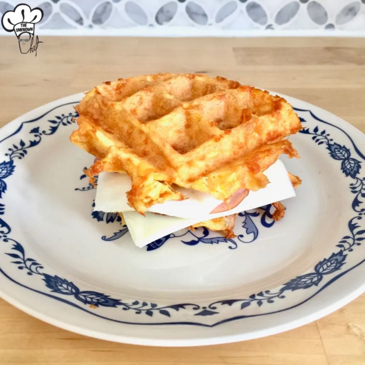  Gluten-Free Chaffle Sandwich on a white-blue plate.