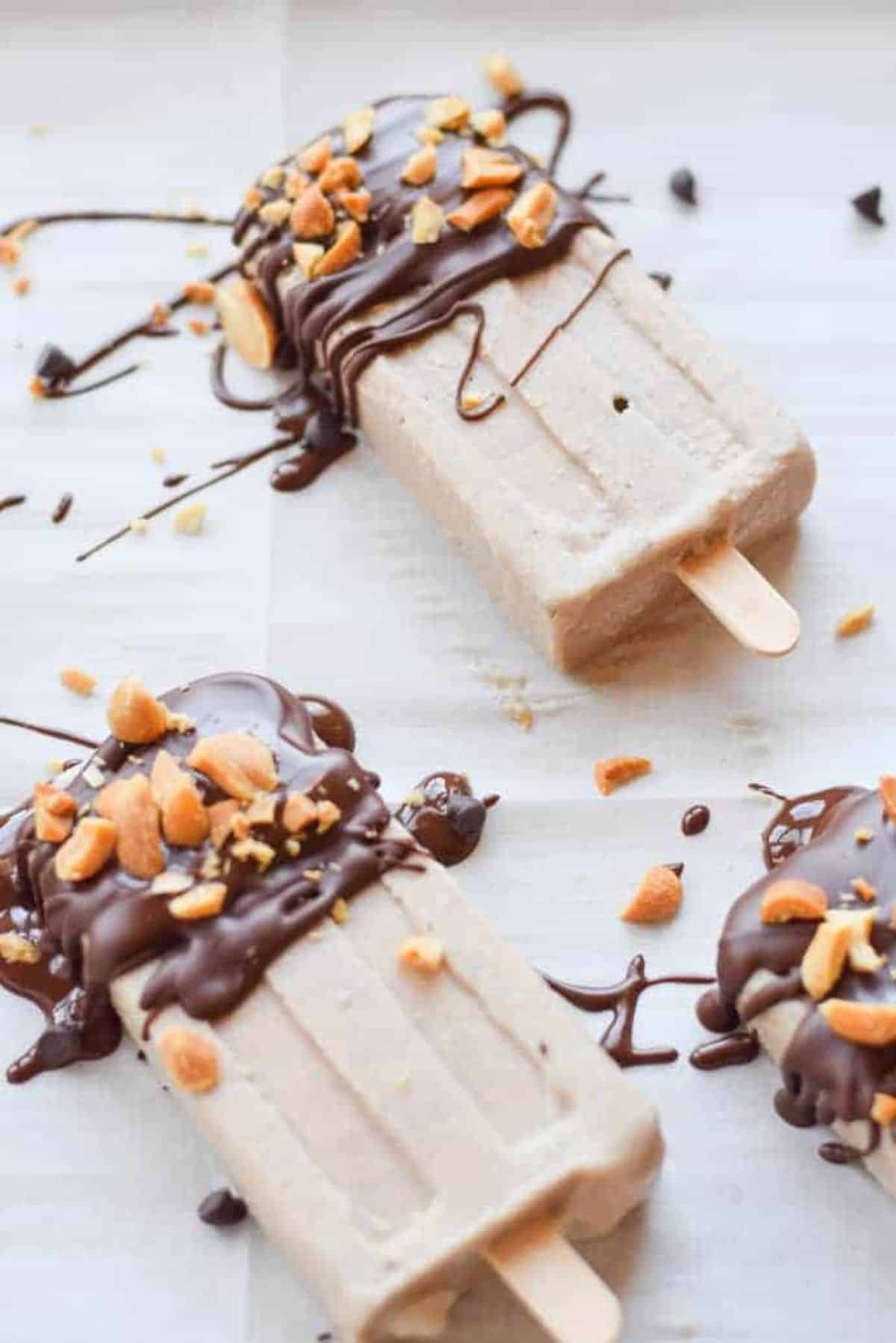 Two gluten-free Chocolate Peanut Butter Banana Popsicles